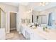 Bathroom featuring dual sinks, a large vanity, and a separate shower and tub at 3072 Oaktree Ln, Duluth, GA 30096
