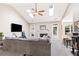 Bright living room featuring a vaulted ceiling, skylights, a fireplace, and patio access at 3072 Oaktree Ln, Duluth, GA 30096