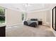 Spacious main bedroom boasts tray ceilings, plush carpeting, and ample natural light from large windows at 3072 Oaktree Ln, Duluth, GA 30096