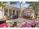 Back patio with chairs and grill; ideal for relaxing or entertaining guests at 3072 Oaktree Ln, Duluth, GA 30096