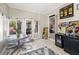 Bright sunroom with tile flooring perfect for dining and entertaining with walk out patio at 3072 Oaktree Ln, Duluth, GA 30096