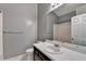 Bathroom featuring a vanity, toilet, and shower/tub at 3625 Ennfield Lane Ln, Duluth, GA 30096
