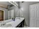 Bathroom features double sinks with white countertop, large mirror, and neutral wall color at 3625 Ennfield Lane Ln, Duluth, GA 30096