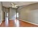 This large bedroom features high ceilings, wood floors, a ceiling fan, and neutral paint at 3625 Ennfield Lane Ln, Duluth, GA 30096
