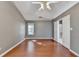 The spacious bedroom features wood floors, neutral paint, and bathroom access through double doors at 3625 Ennfield Lane Ln, Duluth, GA 30096