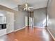 This large bedroom features wood floors, a ceiling fan, and a doorway leading to the ensuite bath at 3625 Ennfield Lane Ln, Duluth, GA 30096