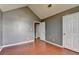 Bedroom featuring wood floors, high ceilings, and neutral paint at 3625 Ennfield Lane Ln, Duluth, GA 30096