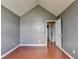 Bedroom featuring wood floors, high ceilings, and neutral paint at 3625 Ennfield Lane Ln, Duluth, GA 30096