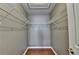 Walk-in closet features built in shelving and a wood floor at 3625 Ennfield Lane Ln, Duluth, GA 30096