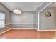 Dining room featuring a modern chandelier, wood floors and wainscoting at 3625 Ennfield Lane Ln, Duluth, GA 30096