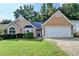 Charming home with a well-manicured lawn and two-car garage at 3625 Ennfield Lane Ln, Duluth, GA 30096