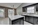 Well-appointed kitchen with stainless steel appliances, island and tile backsplash at 3625 Ennfield Lane Ln, Duluth, GA 30096