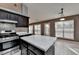 Bright kitchen with an island, stainless steel appliances, and large windows at 3625 Ennfield Lane Ln, Duluth, GA 30096