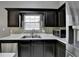 Well-appointed kitchen with stainless steel appliances, island and tile backsplash at 3625 Ennfield Lane Ln, Duluth, GA 30096