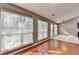 Living room with hardwood floors and windows bringing in natural light at 3625 Ennfield Lane Ln, Duluth, GA 30096