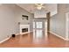 Inviting living room featuring a fireplace, wood floors, and recessed lighting at 3625 Ennfield Lane Ln, Duluth, GA 30096