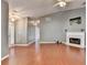 Bright living room featuring a fireplace, ceiling fan, and wood floors at 3625 Ennfield Lane Ln, Duluth, GA 30096