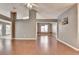 Open-concept living room featuring wood flooring and neutral paint at 3625 Ennfield Lane Ln, Duluth, GA 30096