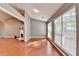 Bright living room with hardwood floors, fireplace, and large windows at 3625 Ennfield Lane Ln, Duluth, GA 30096
