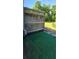Backyard view features lush green grass, privacy fence and patio area at 776 Tulip Poplar Way, Lawrenceville, GA 30044