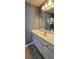 Bathroom features an expansive vanity with a stylish undermount sink, white cabinetry, and tiled floors at 776 Tulip Poplar Way, Lawrenceville, GA 30044