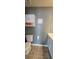 Bathroom featuring wall-mounted storage, modern commode, and neutral walls at 776 Tulip Poplar Way, Lawrenceville, GA 30044