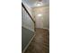 Inviting entryway featuring wood-look tile flooring and a staircase with a wooden handrail at 776 Tulip Poplar Way, Lawrenceville, GA 30044