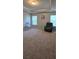 Spacious primary bedroom featuring plush carpeting, tray ceilings, and natural light from two windows at 776 Tulip Poplar Way, Lawrenceville, GA 30044