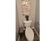 Cozy powder room with a wall-mounted art piece and contemporary fixtures at 776 Tulip Poplar Way, Lawrenceville, GA 30044