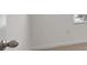 Hallway has carpeted floor and natural light from a window at 8587 Secretariat Dr, Lithonia, GA 30058