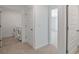 Second floor hallway with a laundry room and views to other rooms at 8587 Secretariat Dr, Lithonia, GA 30058