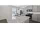 Modern kitchen with granite countertops, stainless steel appliances, and a double sink at 8587 Secretariat Dr, Lithonia, GA 30058