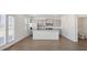 Modern kitchen features stainless steel appliances, granite countertops, and center island at 8587 Secretariat Dr, Lithonia, GA 30058