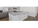 Modern kitchen with stainless steel appliances, granite countertops, and a center island with sink at 8587 Secretariat Dr, Lithonia, GA 30058