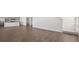 Spacious living area with open layout, hardwood flooring, and modern kitchen at 8587 Secretariat Dr, Lithonia, GA 30058