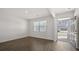 Bright and airy living room features hardwood floors and natural light streaming through the window at 8587 Secretariat Dr, Lithonia, GA 30058