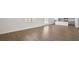 Bright living room offers an open layout with hardwood floors, a kitchen, and lots of natural light at 8587 Secretariat Dr, Lithonia, GA 30058