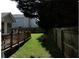 Backyard view that showcases the wooden fence and deck at 857 Asbury Trl, Lithonia, GA 30058