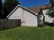 Side view of home showcasing the well-maintained lawn and manicured garden at 857 Asbury Trl, Lithonia, GA 30058