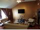 The cozy living room features a cathedral ceiling and comfortable seating perfect for relaxing at 857 Asbury Trl, Lithonia, GA 30058