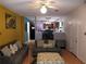 Inviting living room with hardwood floors, modern furniture, and adjacent kitchen view at 857 Asbury Trl, Lithonia, GA 30058