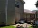 Cozy patio area offers an intimate setting for outdoor dining and entertaining at 857 Asbury Trl, Lithonia, GA 30058