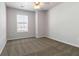 A well-lit bedroom boasts soft carpet flooring and a window with blinds for privacy and light control at 3170 Cedar Glade Ln, Buford, GA 30519