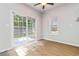Bright dining area with wood-look floors, sliding glass doors to the backyard, and natural light at 3170 Cedar Glade Ln, Buford, GA 30519