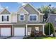 Charming two-story townhome with a well-manicured front yard and attached garage at 3170 Cedar Glade Ln, Buford, GA 30519