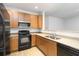 Functional kitchen featuring a microwave, an electric stove, and ample cabinet space at 3170 Cedar Glade Ln, Buford, GA 30519