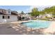 A community pool surrounded by lounge chairs and umbrellas creates a relaxing outdoor space at 3170 Cedar Glade Ln, Buford, GA 30519
