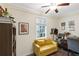 Cozy bedroom with a comfortable seating area, vintage furnishings, and a bright window at 1091 Napier St, Atlanta, GA 30316