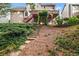 Picturesque backyard view with stone steps, lush greenery, and a spacious deck at 179 Hunters Crk, Dallas, GA 30157