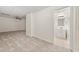 Finished basement with neutral carpet leading to a small bathroom with a tiled floor and single vanity at 179 Hunters Crk, Dallas, GA 30157
